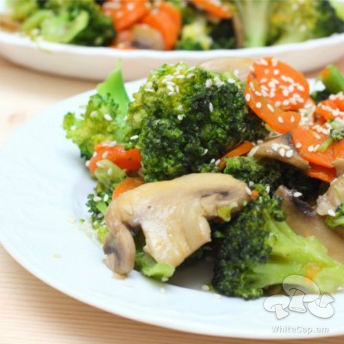 A dish of mushrooms and broccoli